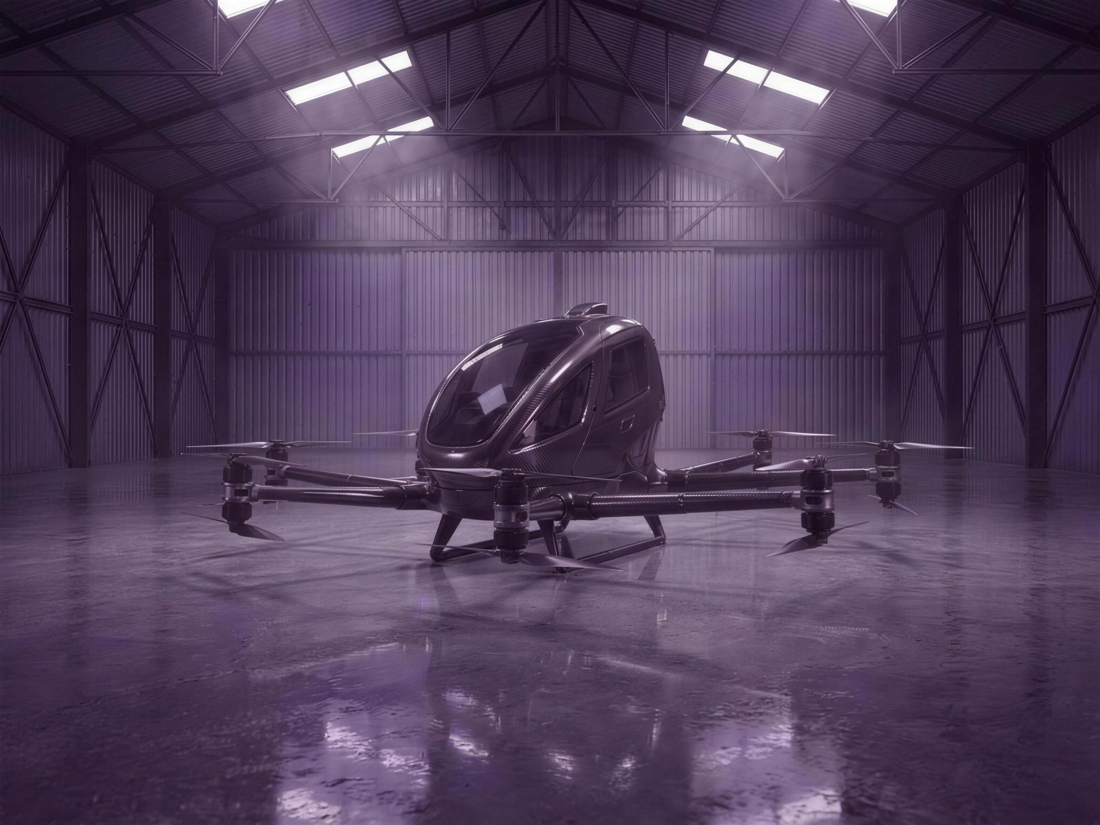 Fantom Xs concept — enclosed two-seat carbon octocopter in the hangar